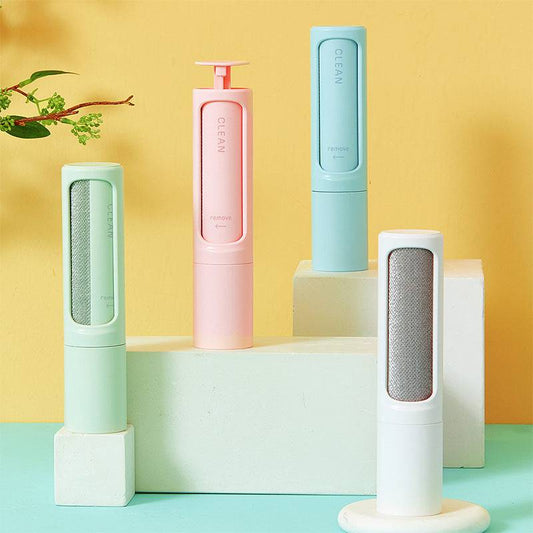 Portable reusable pet hair remover brush and self-cleaning lint roller for pet fur removal, compact and easy to use.