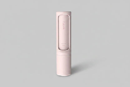 Reusable pet hair remover brush with self-cleaning lint roller, portable and effective for removing pet hair from clothing and furniture.