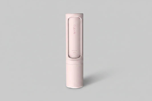 Reusable pet hair remover brush with self-cleaning lint roller, portable and effective for removing pet hair from clothing and furniture.