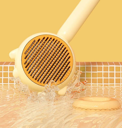 Cat Comb Hair Removal Brush in a playful setting, showcasing its design and effectiveness in groomin.