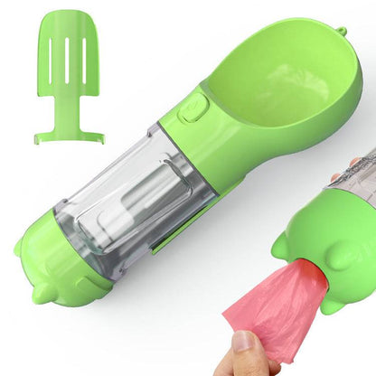 Portable dog water bottle with built-in travel feeder and waste bag holder, ideal for pet travel and outdoor walks.
