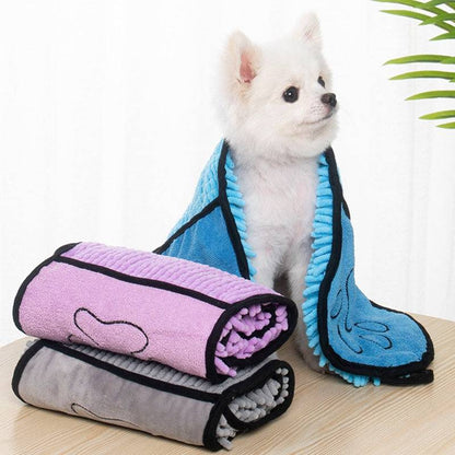 Soft microfiber pet bath towel from My Store, quick-drying and super absorbent, shown draped over a small dog after bath.