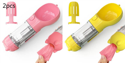 Portable dog water bottle and travel feeder with waste bag holder, compact pet accessory for outdoor walks and travel.