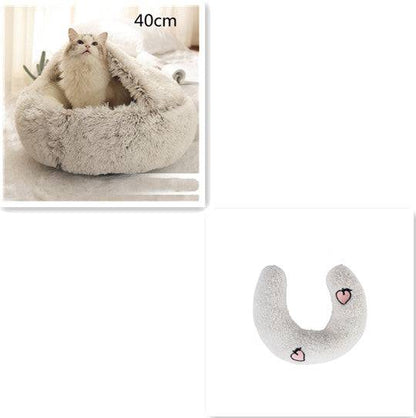 Soft plush 2-in-1 warm pet bed for cats and dogs, cozy self-warming house with cushioned interior and rounded edges.