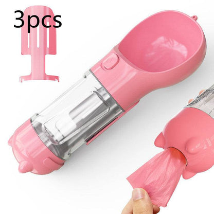 Portable My Store 3-in-1 pet dog water bottle, travel feeder, and waste bag holder for outdoor walks.