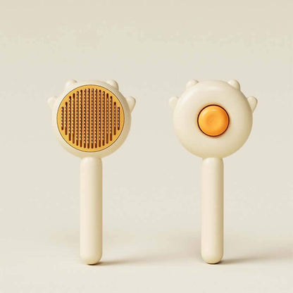 Cat Comb Hair Removal Brush gentle grooming tool with textured and smooth surfaces for pet care.