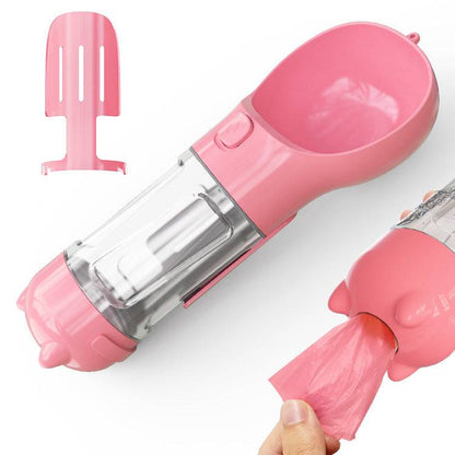 Portable 3-in-1 dog water bottle travel feeder and waste bag holder, compact pet accessory for outdoor walks and travel.