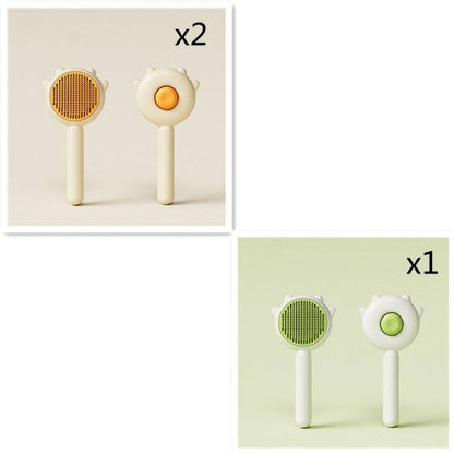 Cute Cat Comb Hair Removal Brush set with yellow and green buttons for grooming pets.