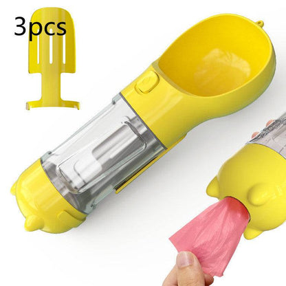 Portable 3-in-1 dog water bottle, travel feeder, and waste bag holder for pet hydration and cleanup on the go.