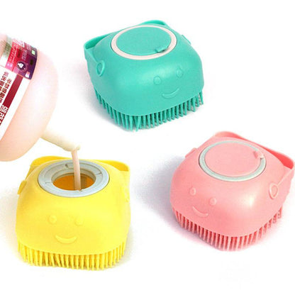 Silicone dog bath massage brush with shampoo dispensing feature, pet grooming tool in blue with textured bristles for gentle cleaning.