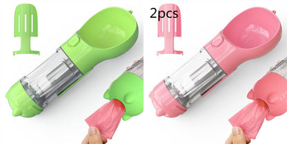 Portable 3-in-1 dog water bottle, travel feeder, and waste bag holder with ergonomic design for pet travel convenience.